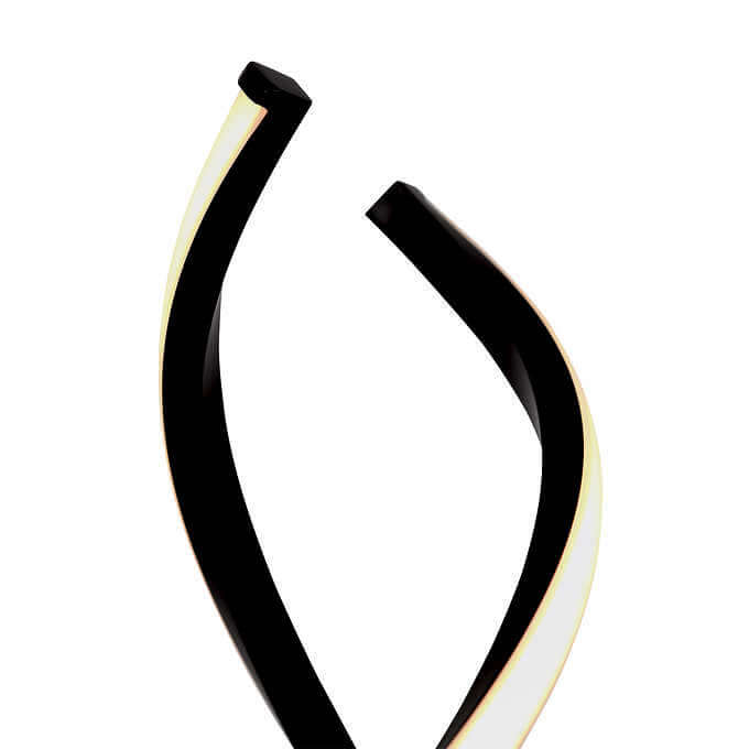 A close-up of a black curved structure with a glowing inner edge, possibly part of a modern lamp design.