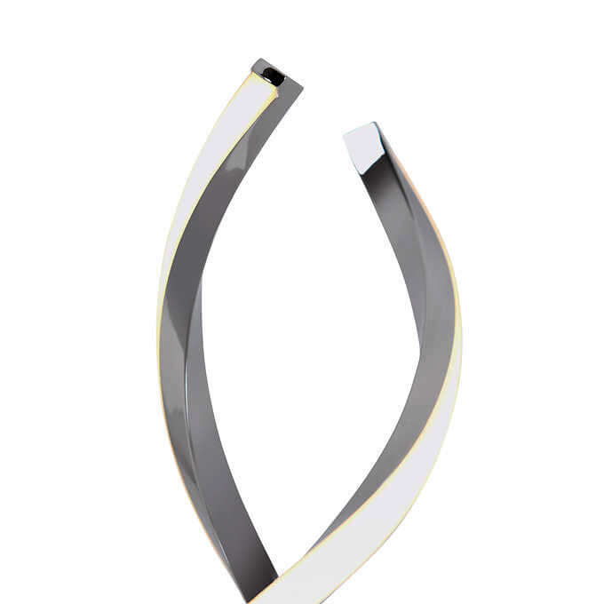 A close-up of a curved, black structure with an illuminated edge, forming an open loop shape.