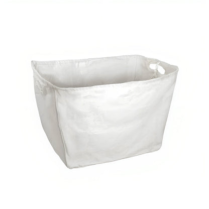 A simple white fabric laundry basket with a slightly tapered design and a loop handle on the side.